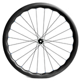 Carbon road bike rear wheel built with DT Swiss 180 hub, areodynamic wave shape, blue nipples